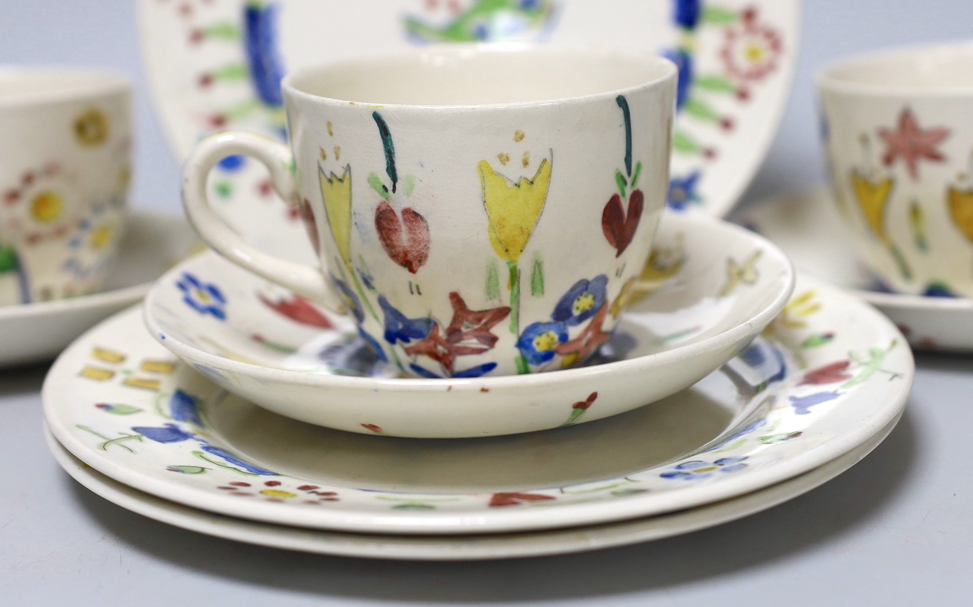 Jessie Marion King (1875-1949). Three different floral design tea cups, saucers and plates